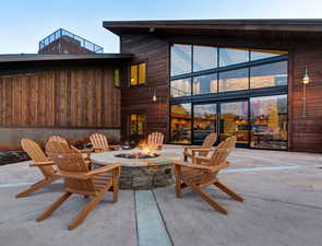 View of patio featuring a fire pit