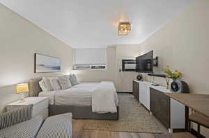 Bedroom featuring hardwood / wood-style flooring