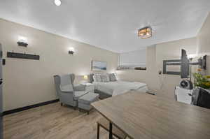 Bedroom with light wood-type flooring