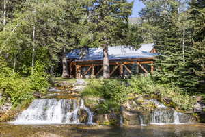 Rear view of house with a water view