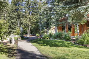 View of home's community featuring a lawn