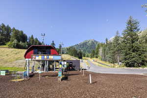 View of playground featuring a mountain view