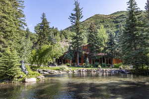 View of water feature with a mountain view