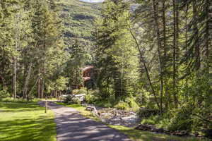 View of property's community featuring a lawn