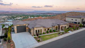 View of front facade featuring a mountain view and a garage