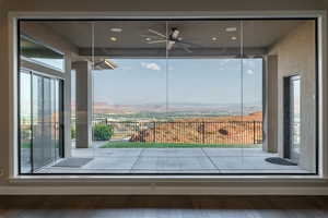 Interior space with hardwood / wood-style flooring and ceiling fan