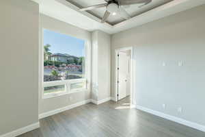 Unfurnished room with ceiling fan and hardwood / wood-style floors