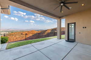 View of patio featuring ceiling fan and a mountain view