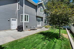 Exterior space featuring a patio and a lawn