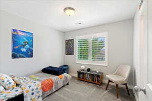 Bedroom featuring carpet flooring