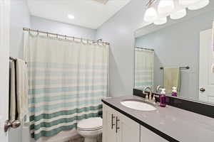 Bathroom with vanity and toilet