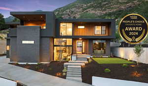 Contemporary house with a mountain view and a yard