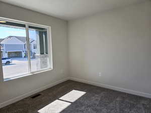 Unfurnished room featuring carpet floors