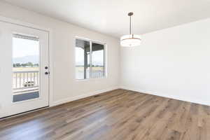 Interior space featuring dark wood-type flooring and a wealth of natural light