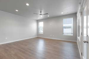 Empty room featuring ceiling fan and wood-type flooring