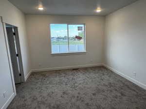 Empty room featuring carpet