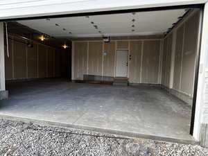 Garage featuring a garage door opener