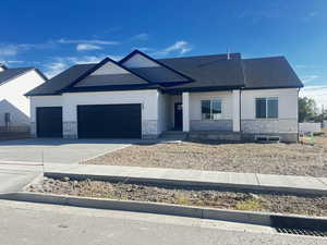 View of front of home featuring a garage