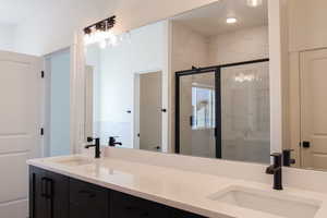 Bathroom with vanity and walk in shower