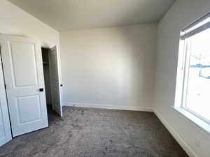 Unfurnished bedroom with carpet