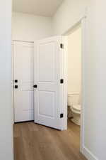 Hallway featuring light hardwood / wood-style flooring