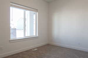 Unfurnished room with carpet floors