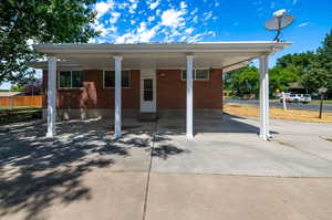 Exterior space featuring a carport