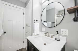 Bathroom with vanity and hardwood / wood-style flooring