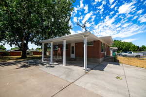 View of front facade with a carport