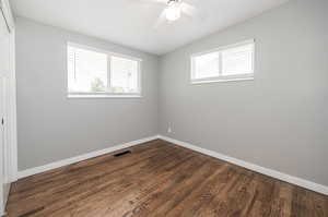 Unfurnished room featuring wood-type flooring and ceiling fan