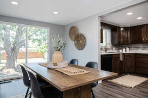 Dining area featuring hardwood / wood-style flooring and sink