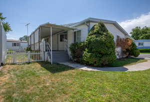 View of front of property with a front yard