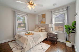 Bedroom featuring wood-type flooring and ceiling fan