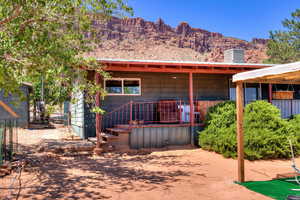 Rear view of property featuring a mountain view