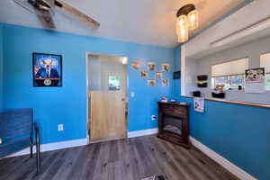 Interior space featuring plenty of natural light and dark wood-type flooring