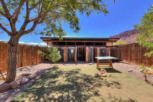 Exterior space with a mountain view and an outbuilding