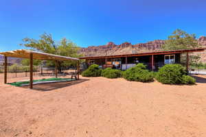 Back of property with a mountain view