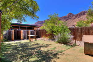 View of yard with a mountain view and an outdoor structure