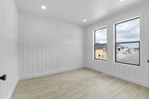 Spare room featuring light hardwood / wood-style floors