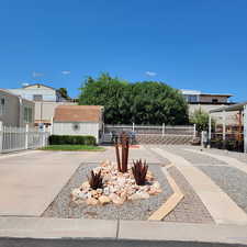 Lot 132. Lot Extends Behind the Oleander Bushes Behind White Picket Fence to the Community Tan Vinyl Fence. Lot is 60'X35'. From Back retaining wall to front is 49'