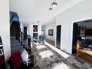 Hallway with dark tile patterned flooring