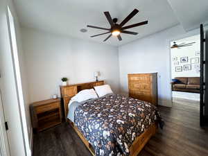 Bedroom featuring dark hardwood / wood-style flooring and ceiling fan