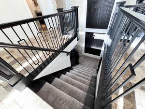 Stairway featuring tile patterned floors