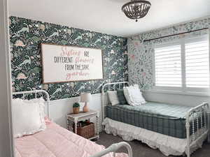 Bedroom featuring a textured ceiling and carpet flooring