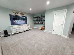 Living room featuring light colored carpet