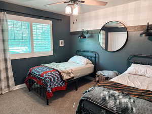 Bedroom with carpet and ceiling fan