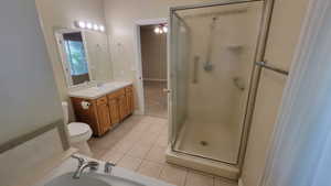 Main Bathroom featuring jetted tub and separate shower