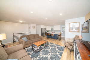 Living room featuring light laminate floors