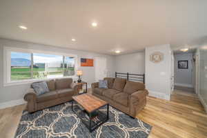 Living room featuring light laminate flooring