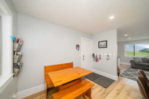 Dining area featuring light laminate floors